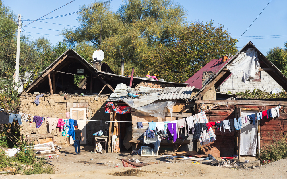 UZHGOROD, UKRAINE - Oct. 10, 2021: Roma houses. Gypsy slums on the outskirts of Uzhgorod in a roma village in Western Ukraine. People living in miserable conditions.